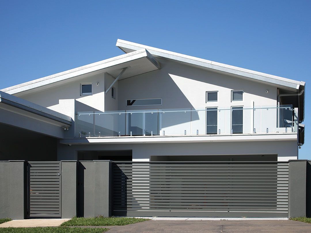 Frameless glass balustrade with silver spigots and internal hand rail