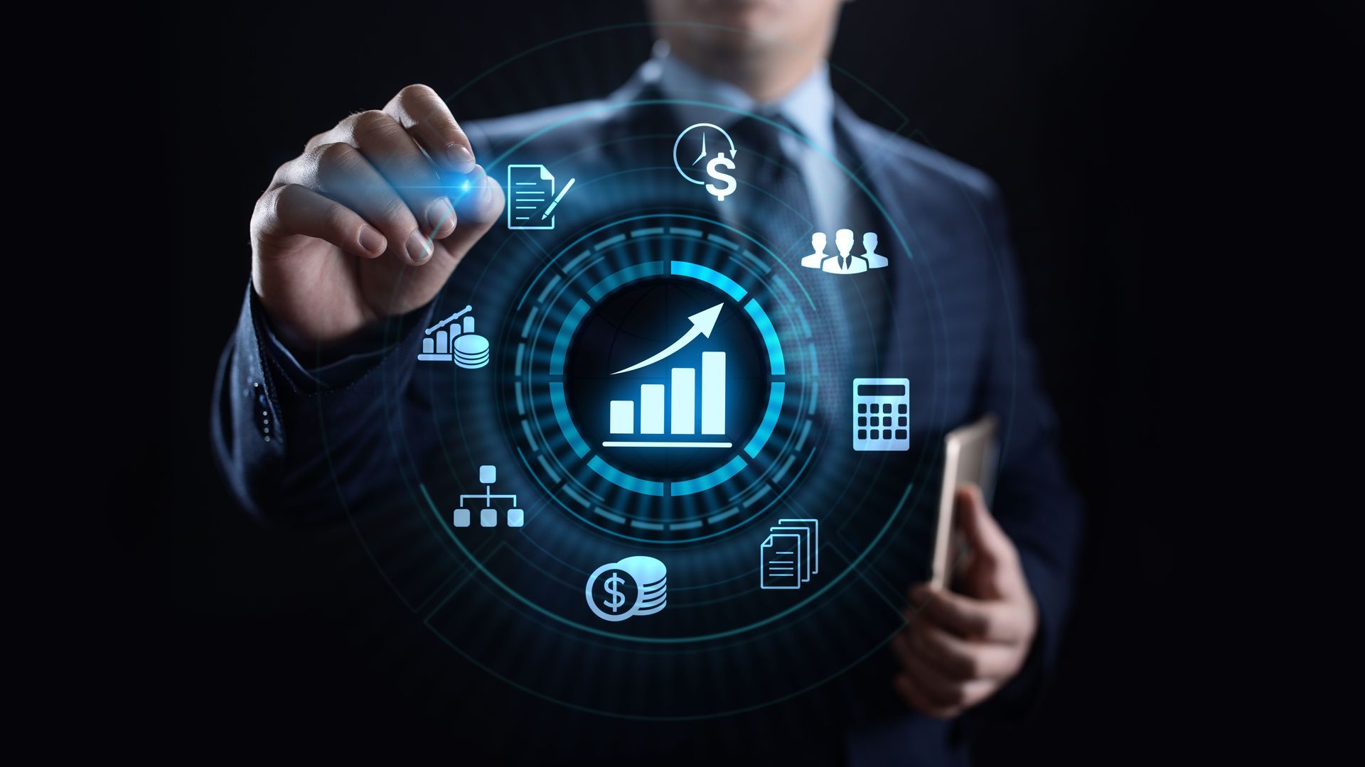 A man in a suit is drawing a graph on a screen.