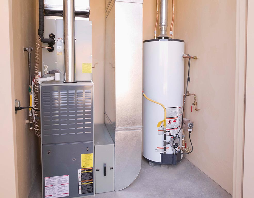 Furnace and water heater inside an enclosed utility closet.