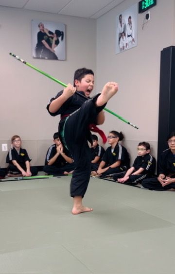 An aerial view of a city skyline at sunset.