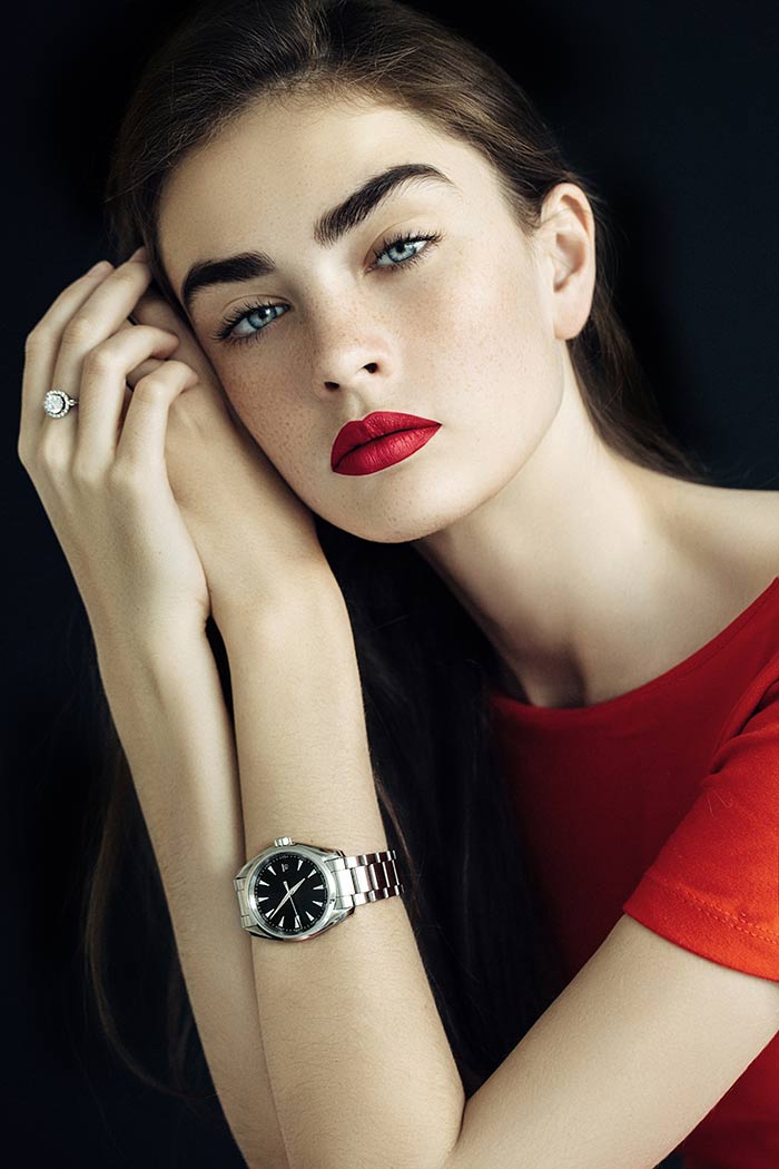 a lady wearing a stylish watch