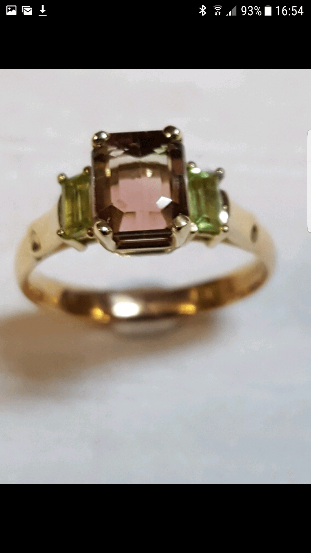 ring with green and brown stones