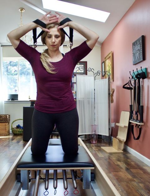 Women on Pilates reformer