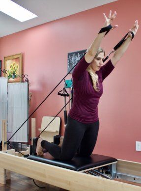 woman on the Pilates reformer