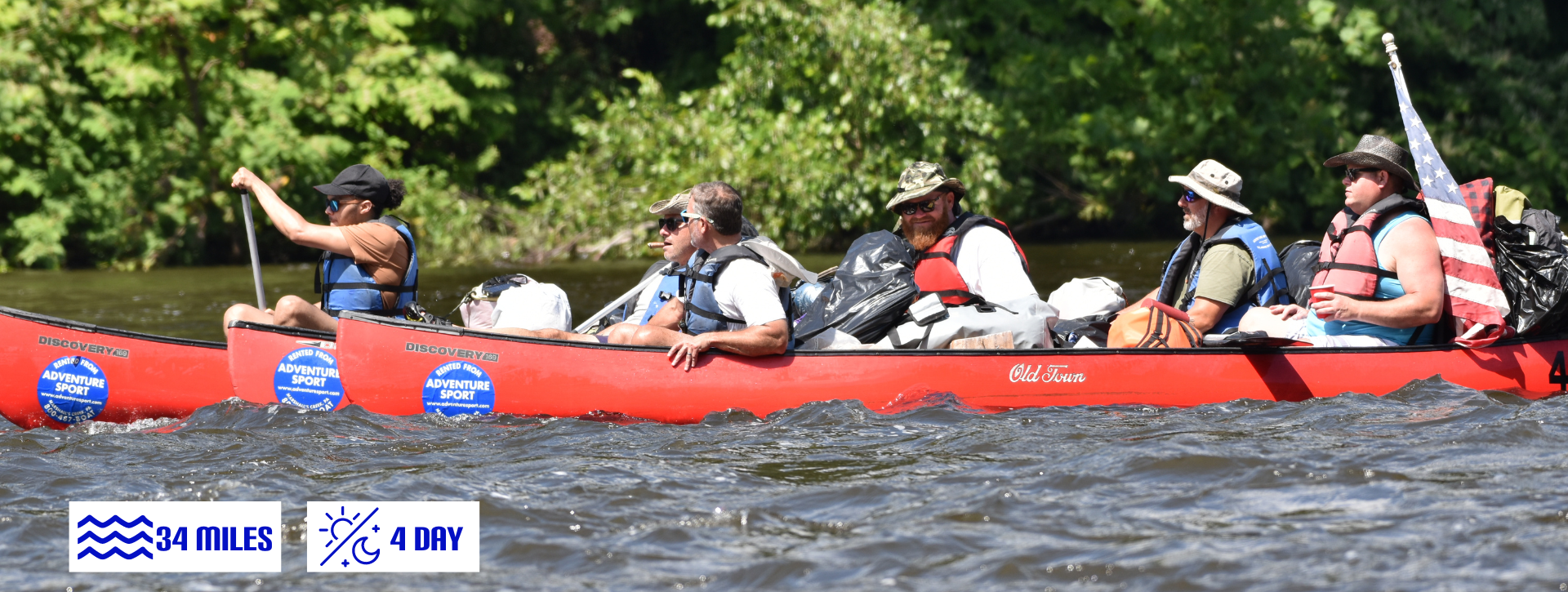 A group of people are in a red canoe from adventure sports on Delaware river.