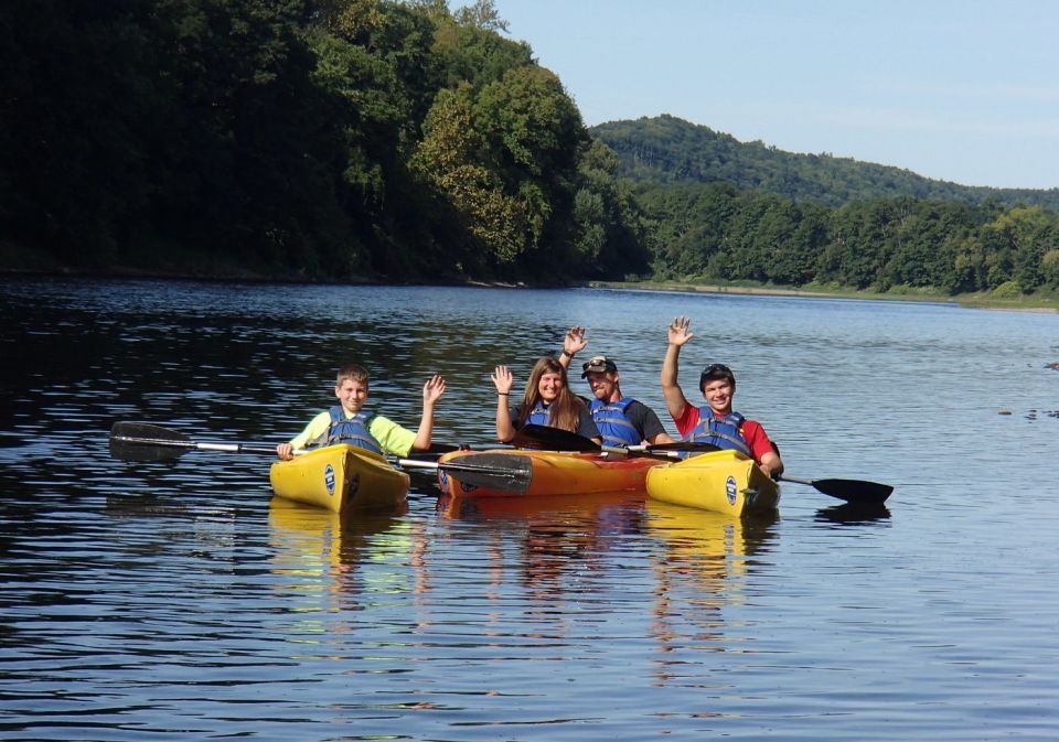 A group of people are in kayaks on a lake.