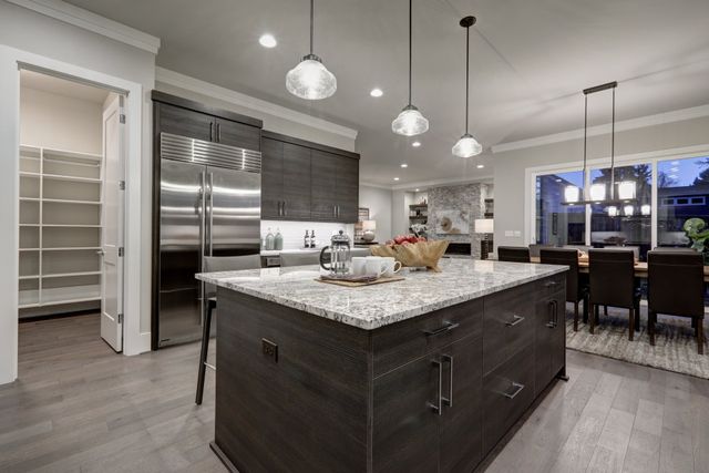 Stock Photo Modern Open Plan Gray Kitchen Features Dark Gray Cabinets Paired With Granite Countertops Open 557517382 640w 