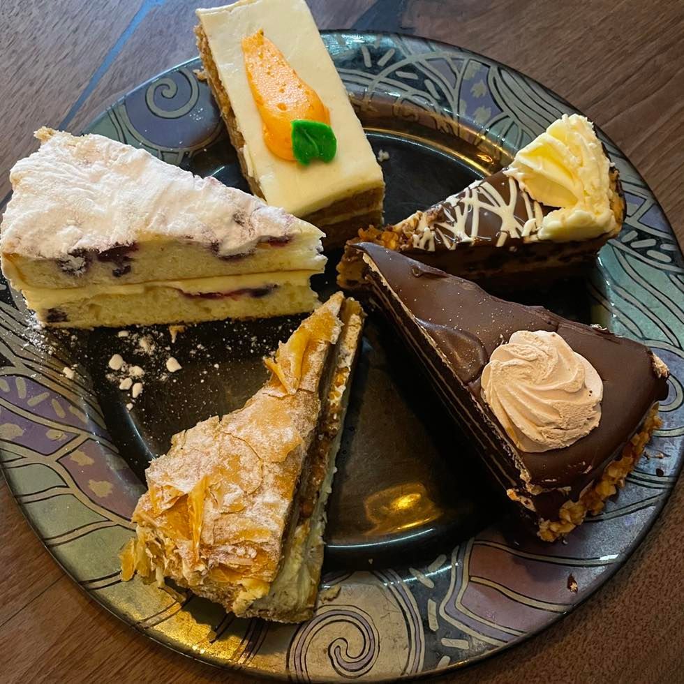 A plate with a variety of desserts on it