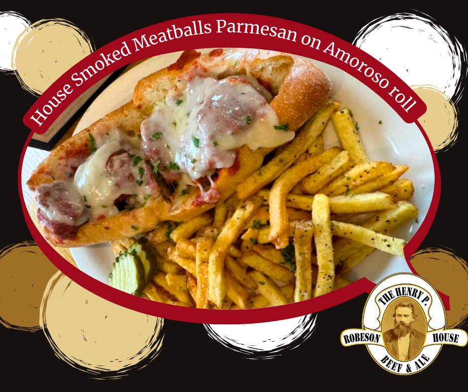 A plate of food with french fries and a sandwich that says house smoked meatballs parmesan on amoroso roll