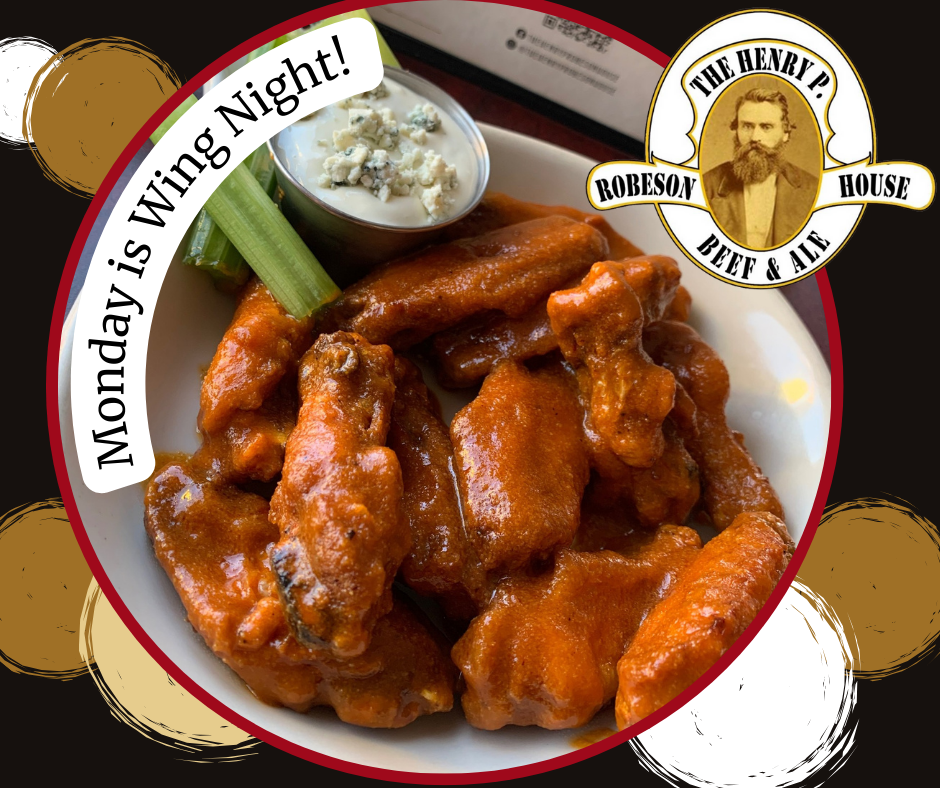 A plate of chicken wings with celery and blue cheese says monday is wing night
