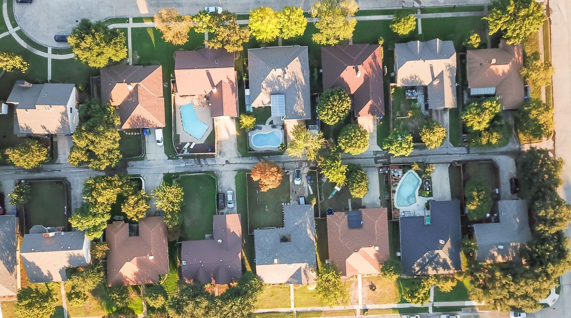 Overhead shot of neighborhood with shingle roofs