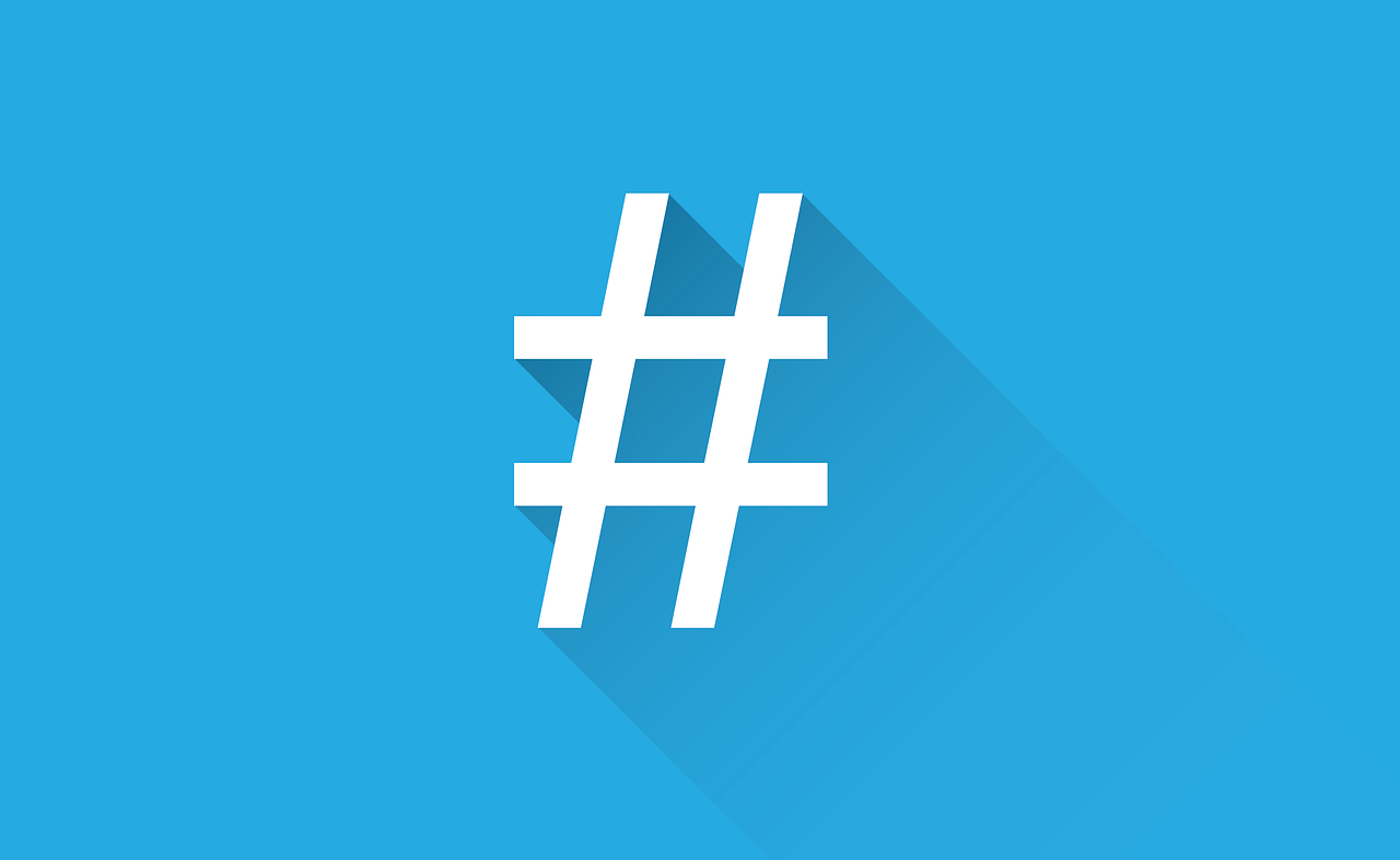 A white hashtag icon with a long shadow on a blue background.