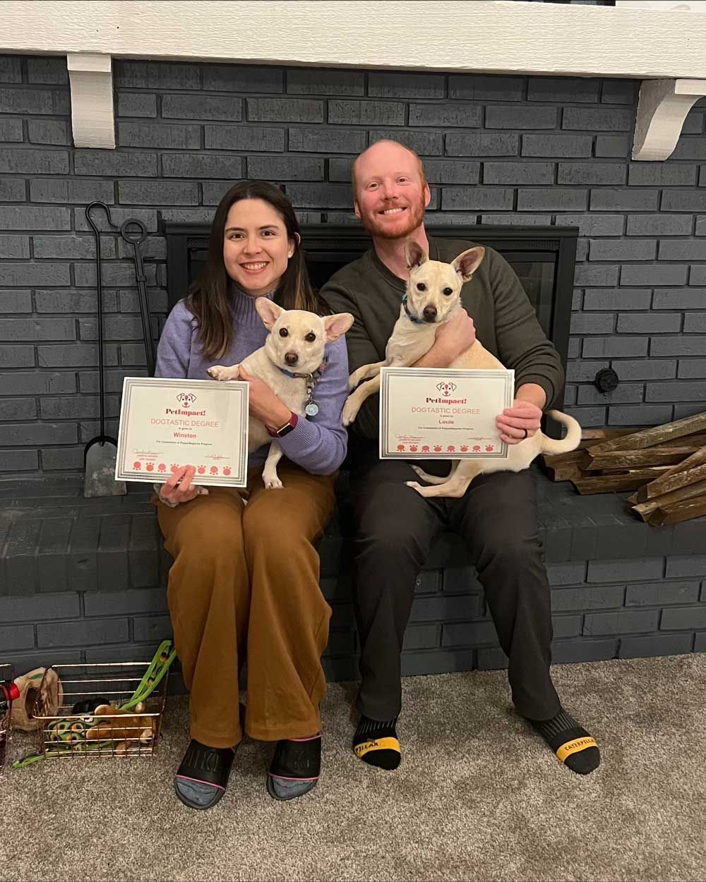 A Couple with Their Dogs and Certificate — St. Louis, MO — PetImpact!
