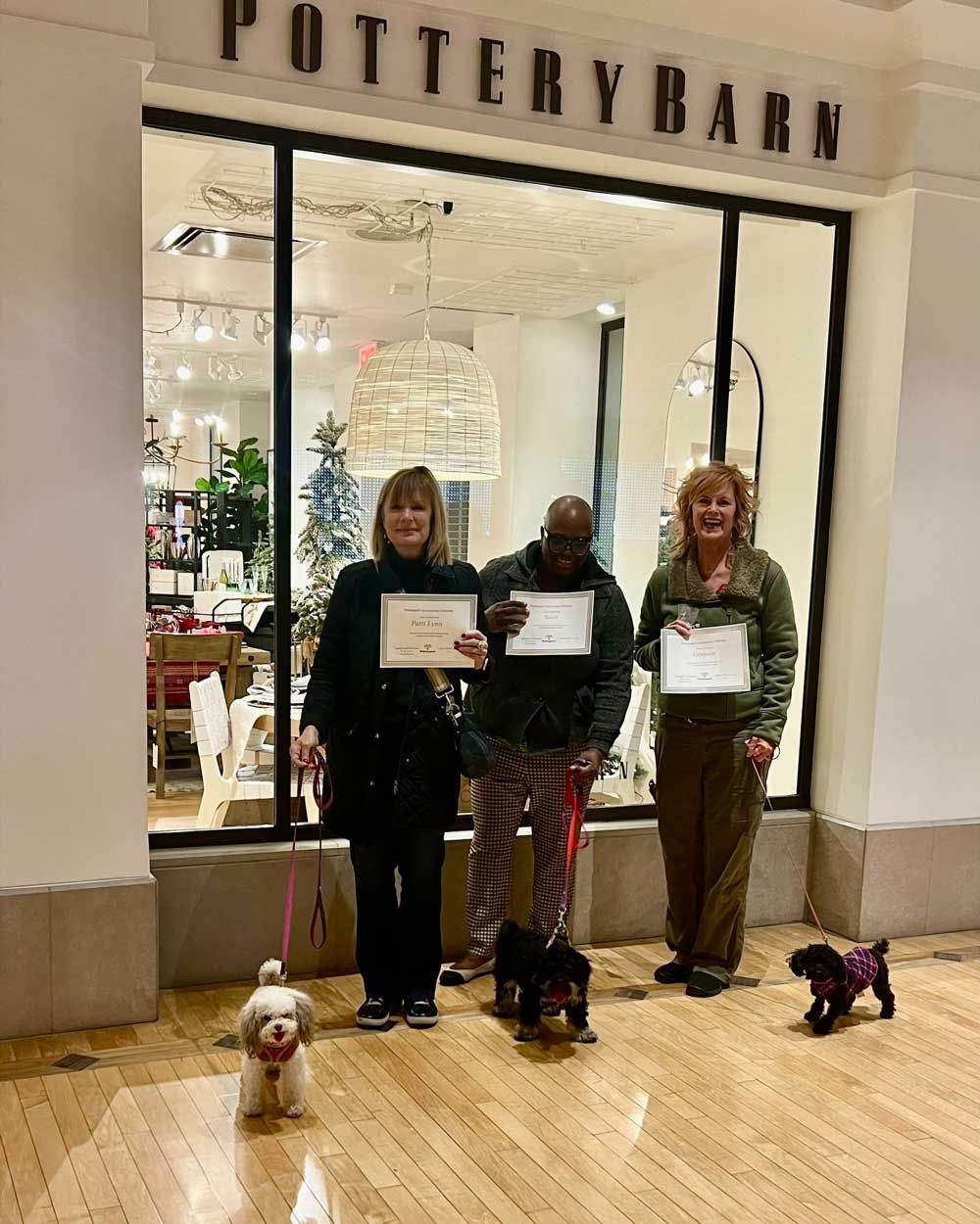 Three Pet Owners Holding Their Certificates — St. Louis, MO — PetImpact!