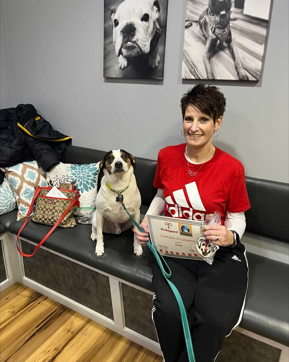Woman Sitting with Her Dog — St. Louis, MO — PetImpact!