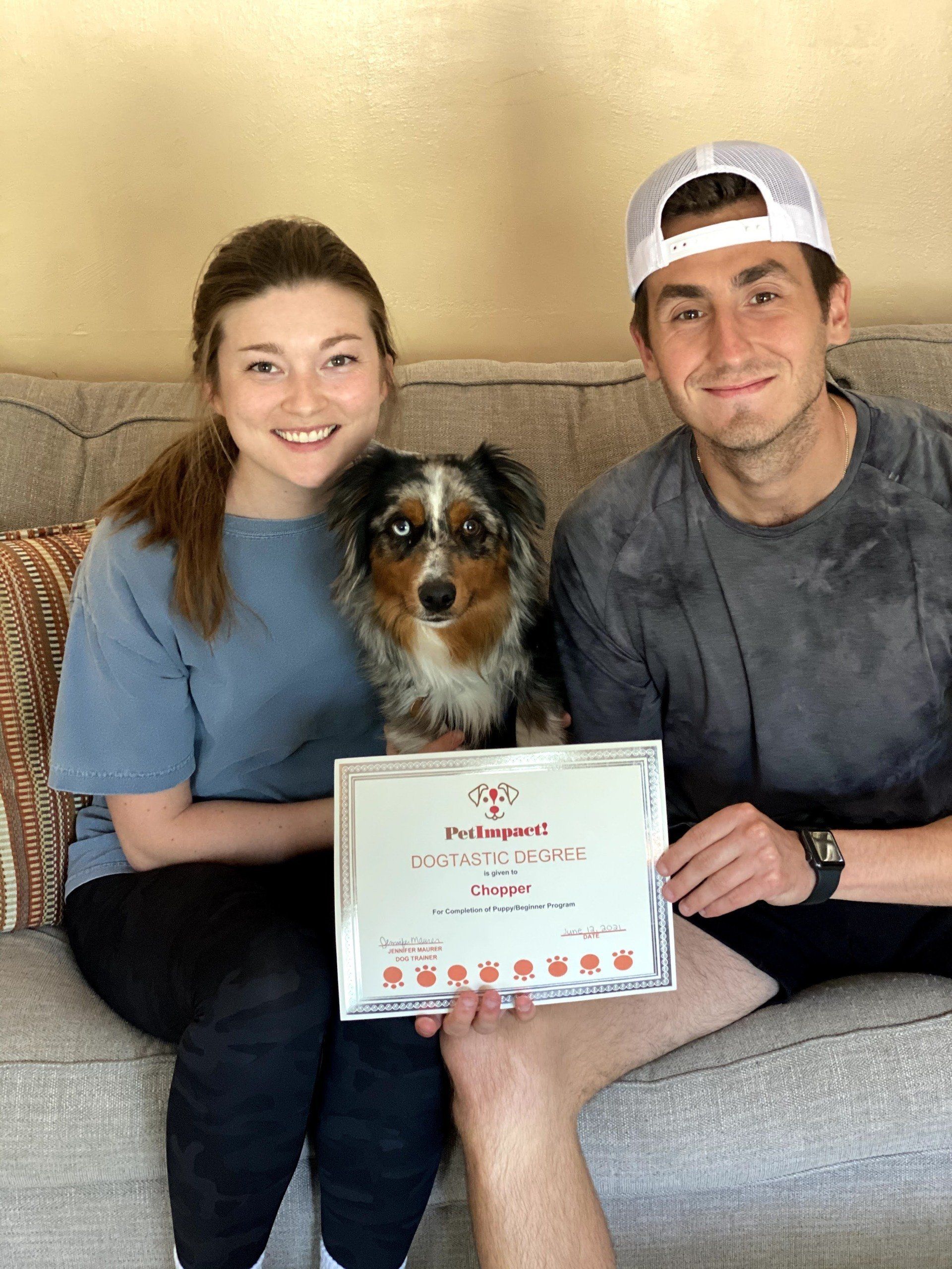 Dog Chopper With Its Owners Holding Certificate — St. Louis, MO — PetImpact!