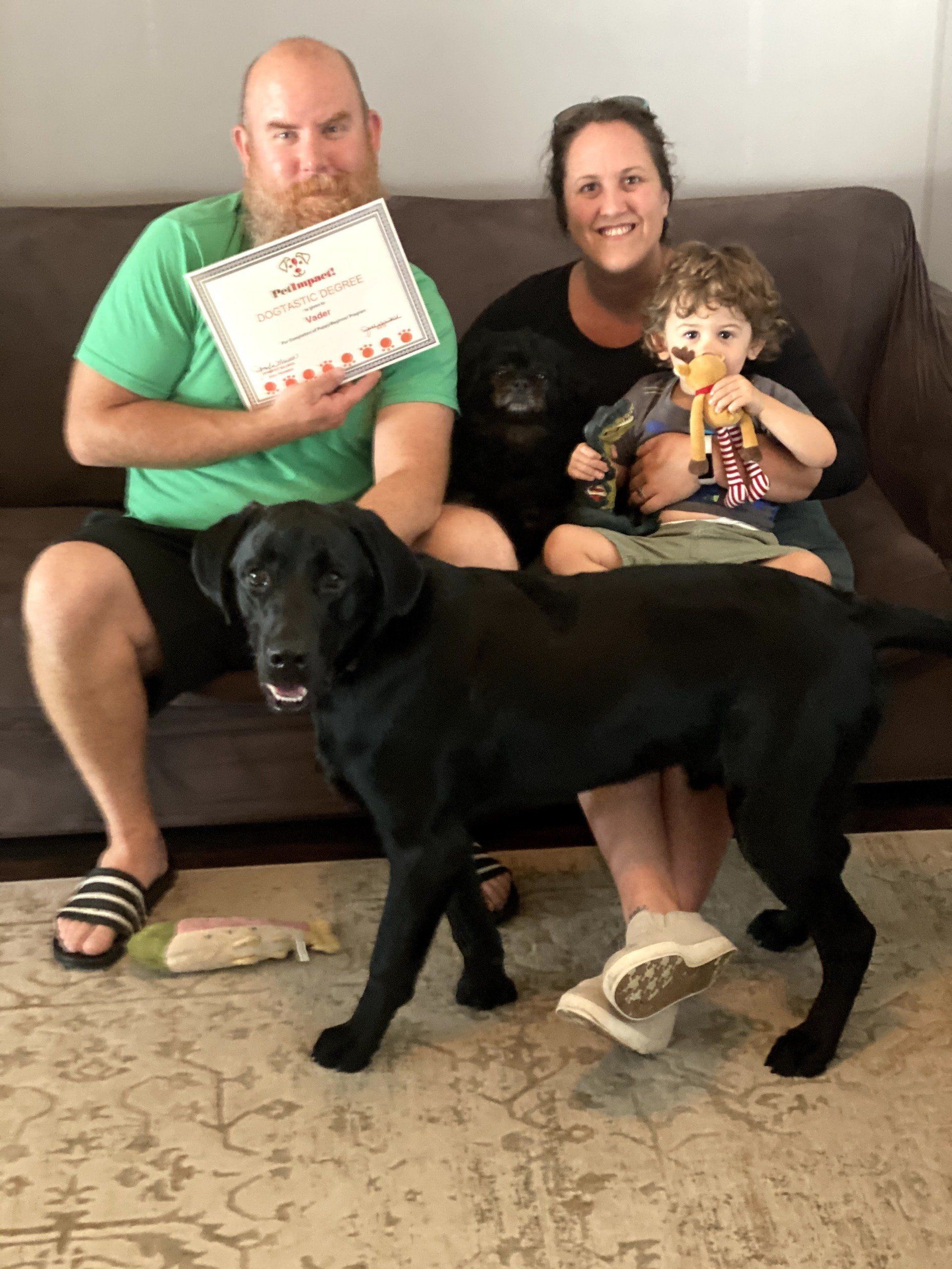 Dog Vader With Its Owner Holding Certificate — St. Louis, MO — PetImpact!