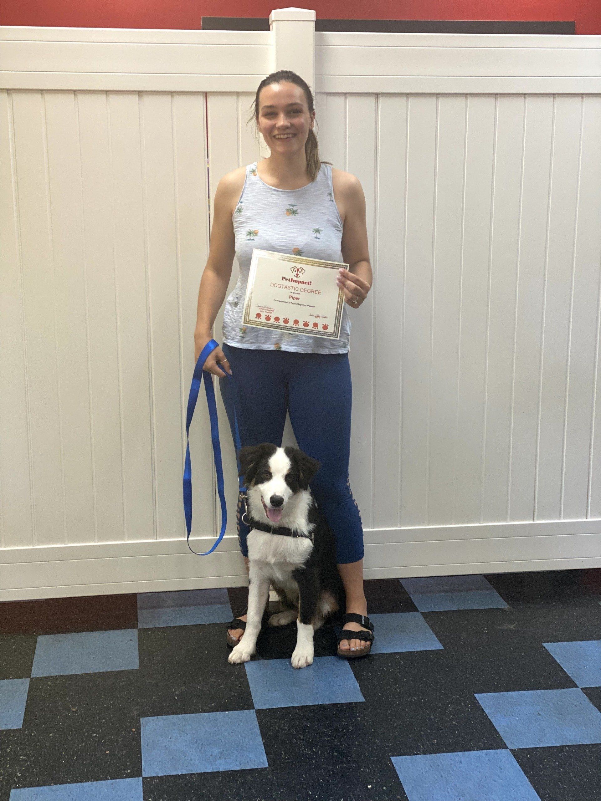 Cute Dog  With Its Owner Holding Certificate — St. Louis, MO — PetImpact!