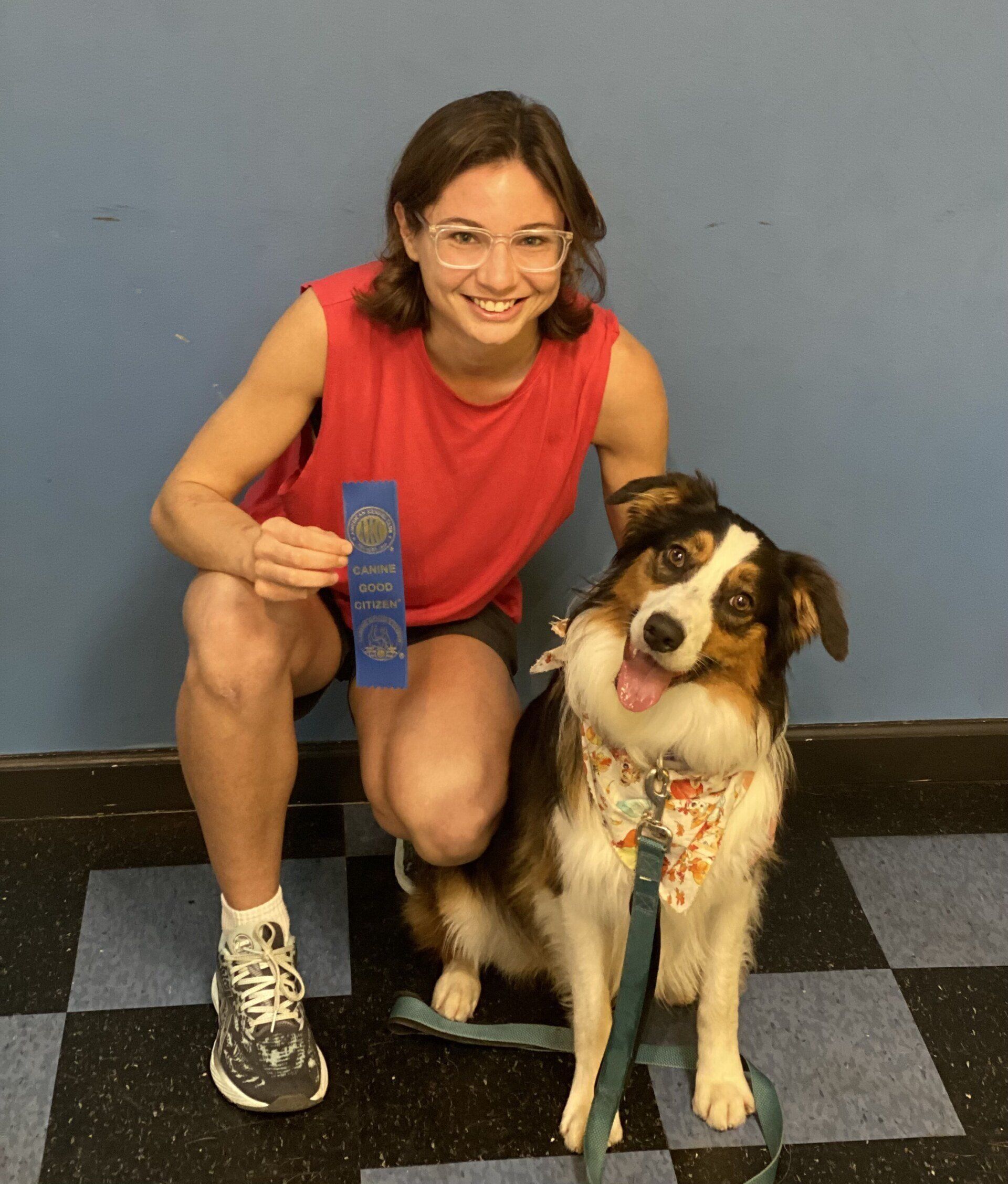 Cute Dog With Its Lady Owner Holding Ribbon Award — St. Louis, MO — PetImpact!