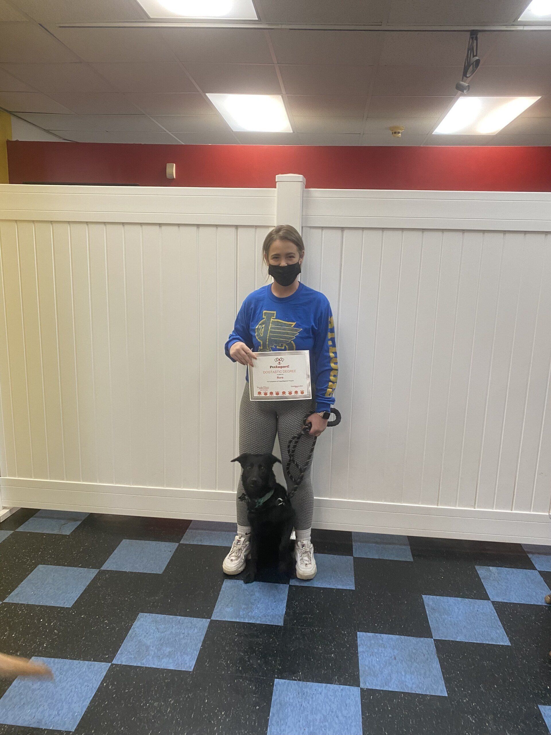 Dog Rora With Its Lady Owner Holding Certificate — St. Louis, MO — PetImpact!
