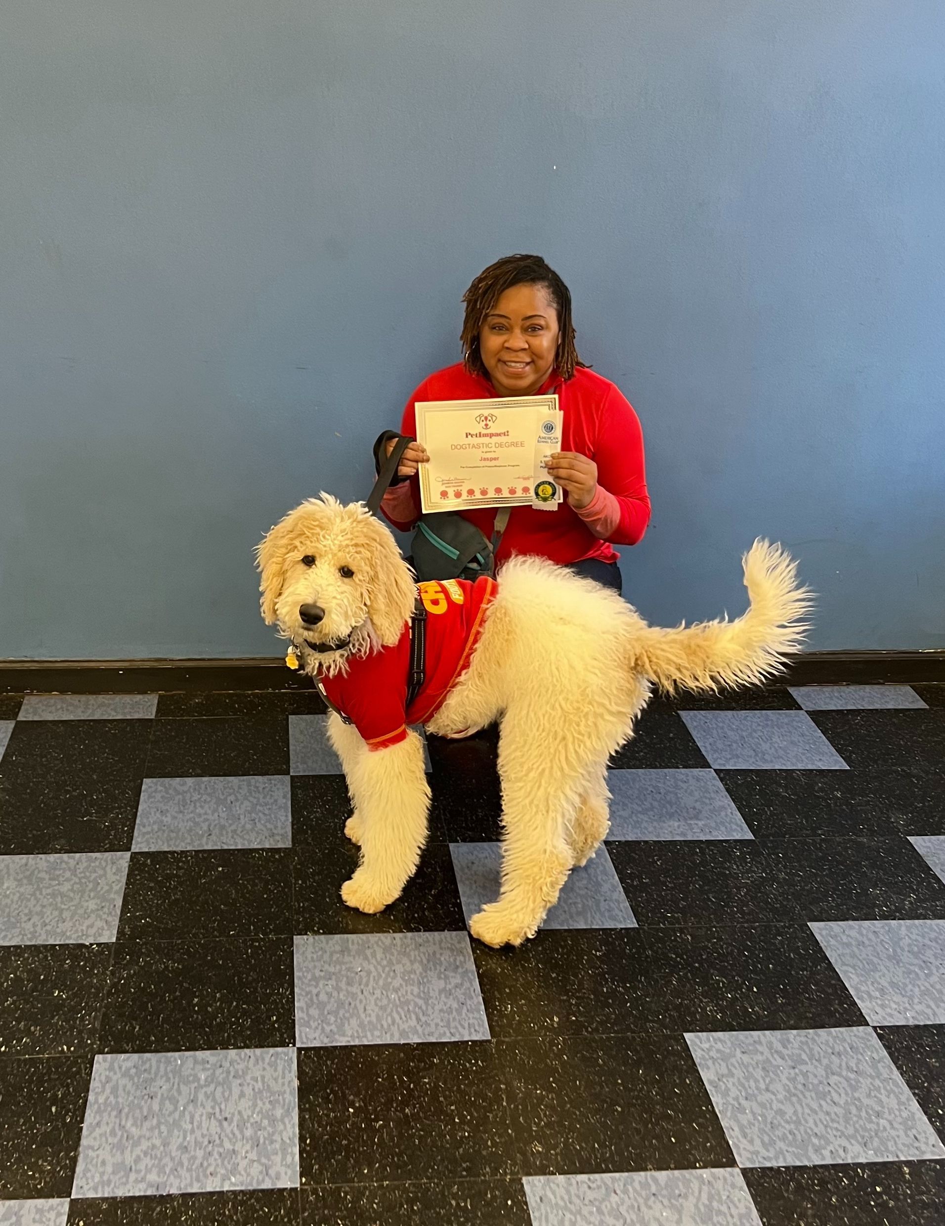 Women Holding a Certificate — St. Louis, MO — PetImpact! Dog Training