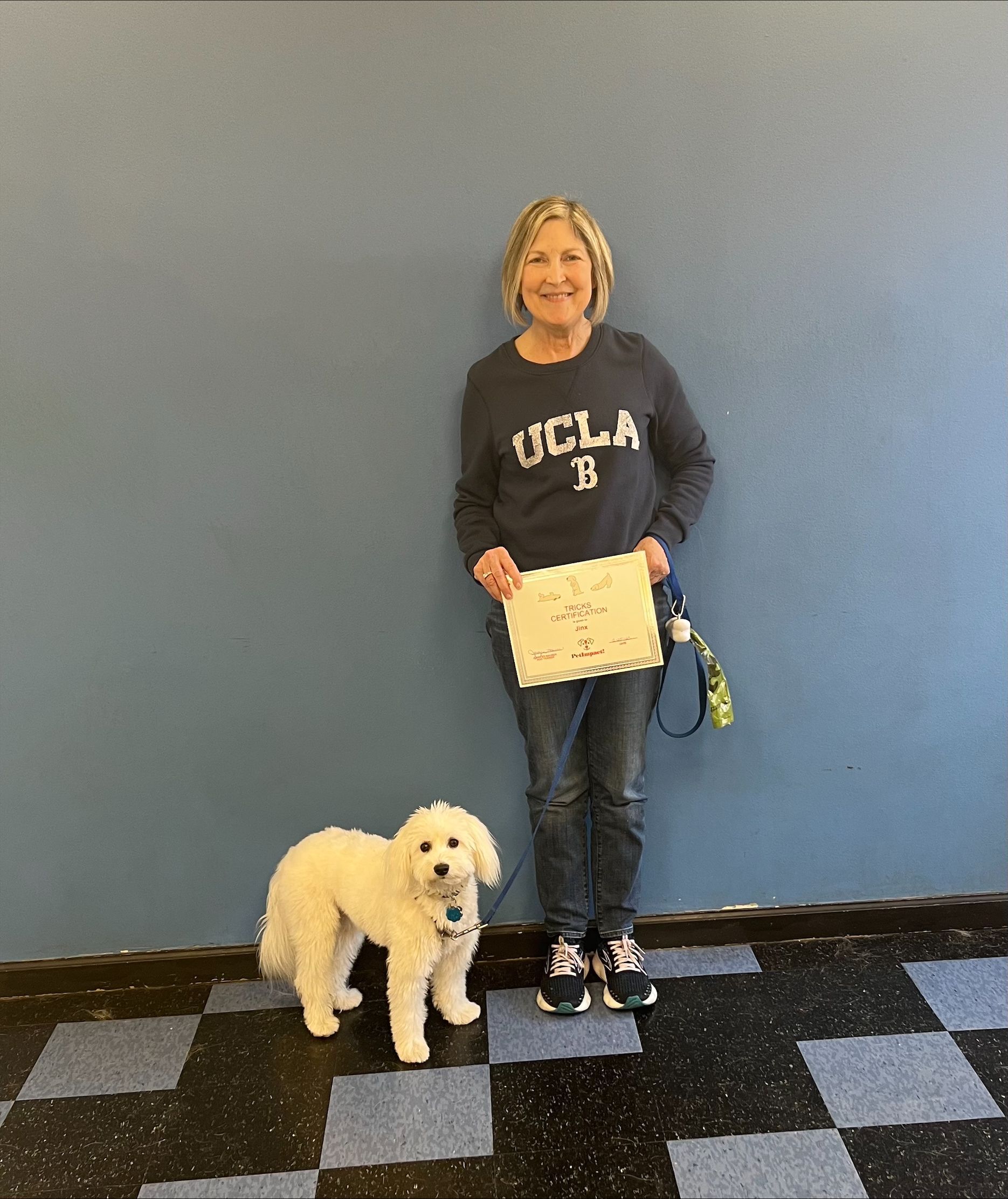 An Old Woman Holding a Certificate With Her Dog — St. Louis, Mo — Petimpact!