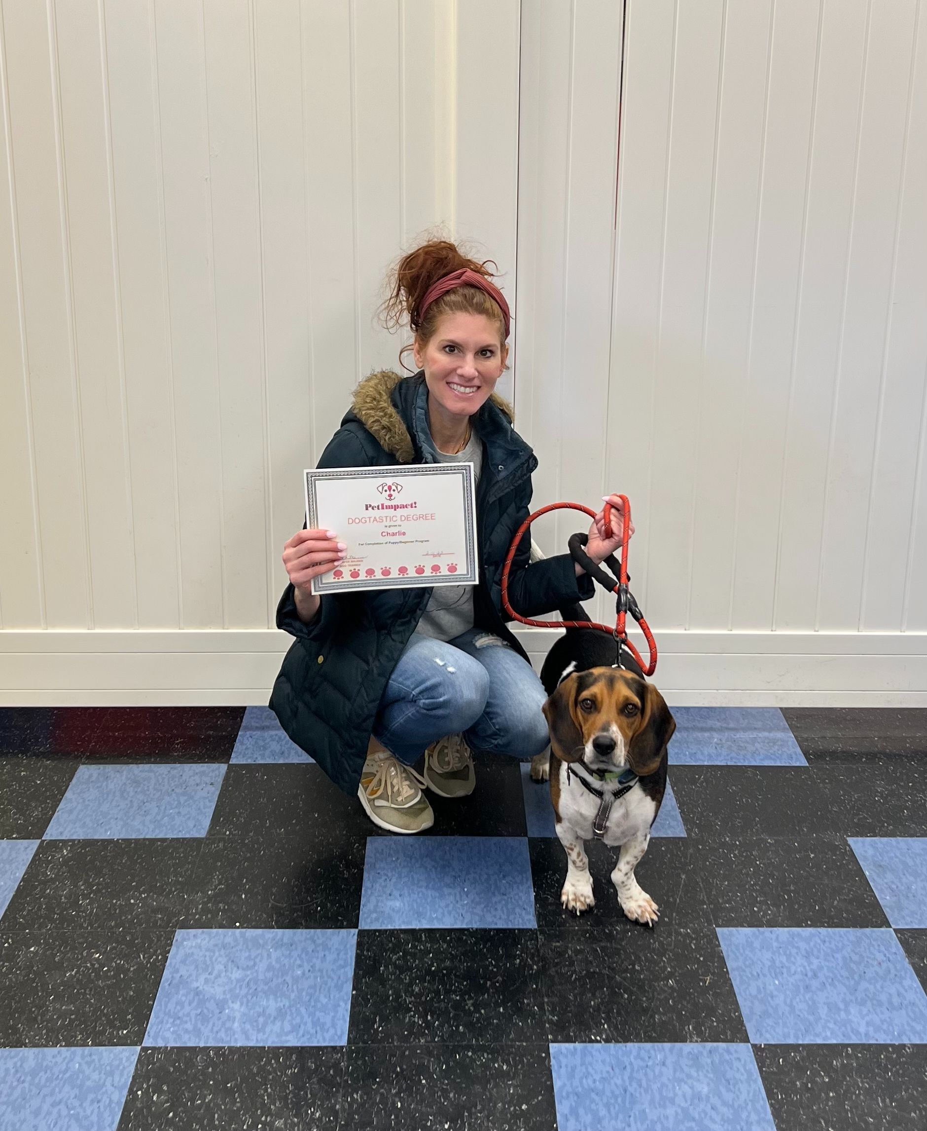Close Up Photo of a Women Holding Certificate — St. Louis, MO — PetImpact! Dog Training