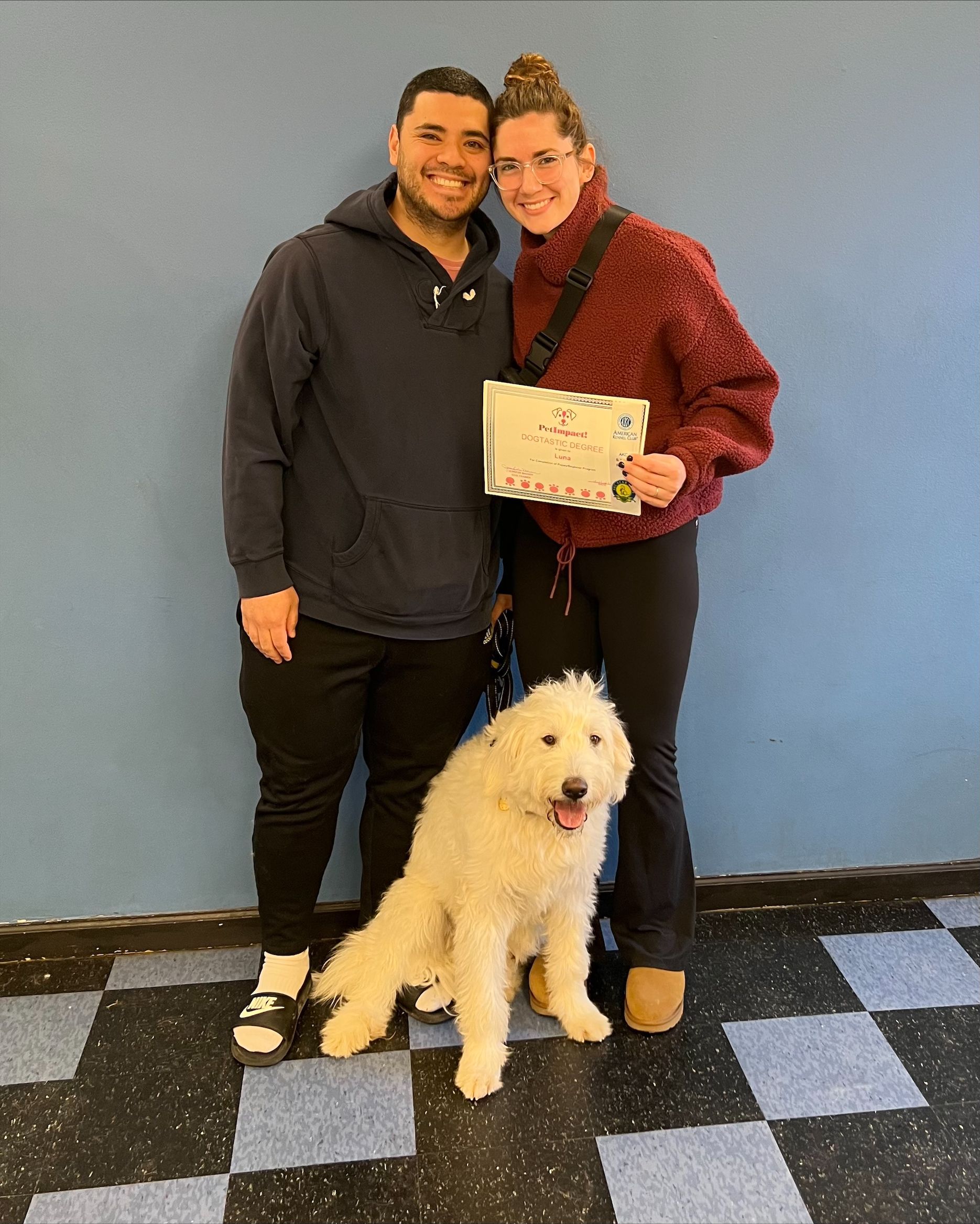 Happy Couple Holding Certificate With Their Dog — St. Louis, MO — PetImpact! Dog Training