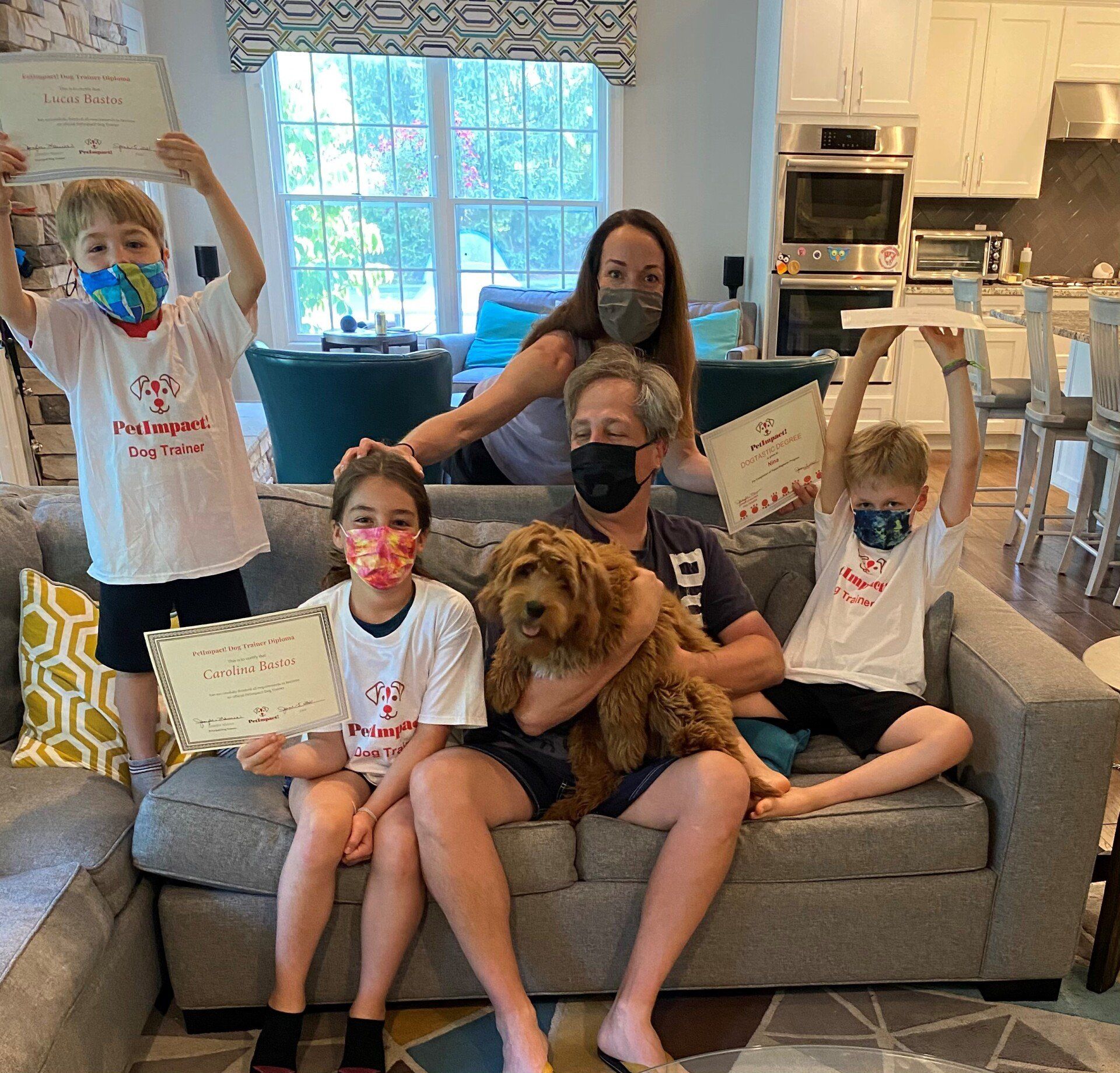 Pet Family Owners With Their Dog — St. Louis, MO — PetImpact!