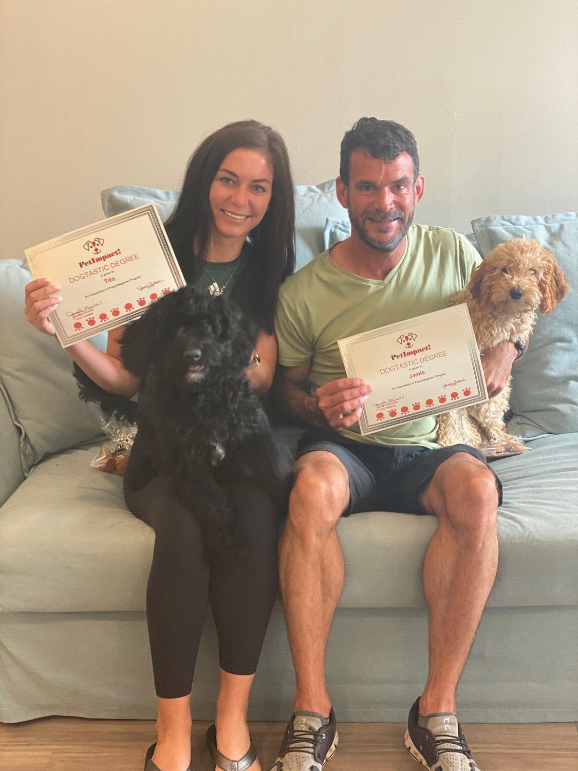 Happy Couple and Two Dogs with Certificates — St. Louis, MO — PetImpact!