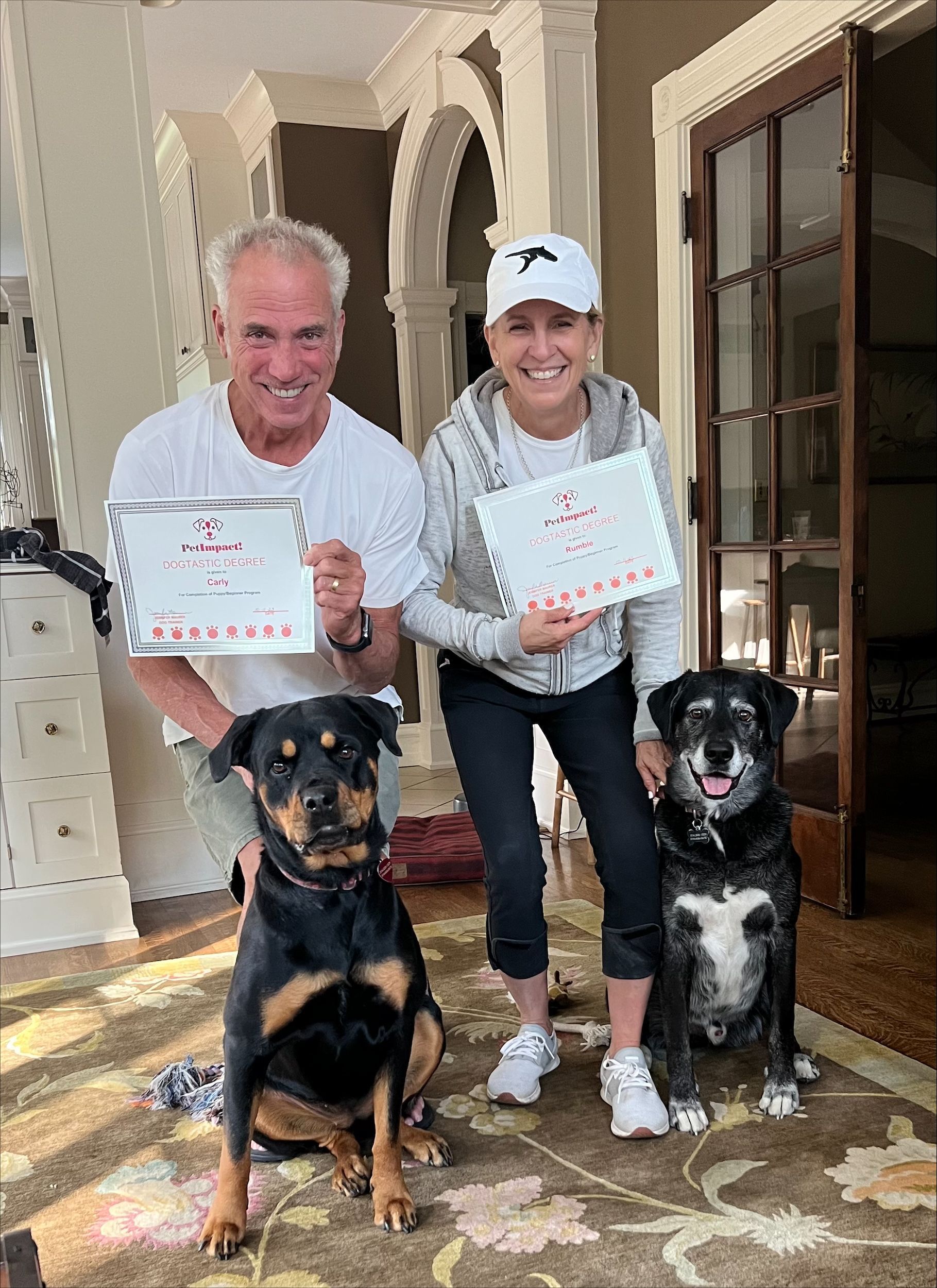 A happy fur parents having a photo with their lovable dogs — St. Louis, Mo — Petimpact!