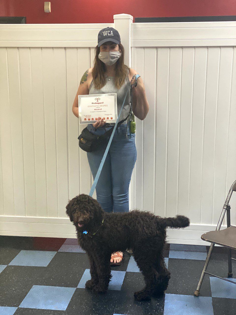 Dog Woodruff With Its Lady Owner Holding Certificate — St. Louis, MO — PetImpact!