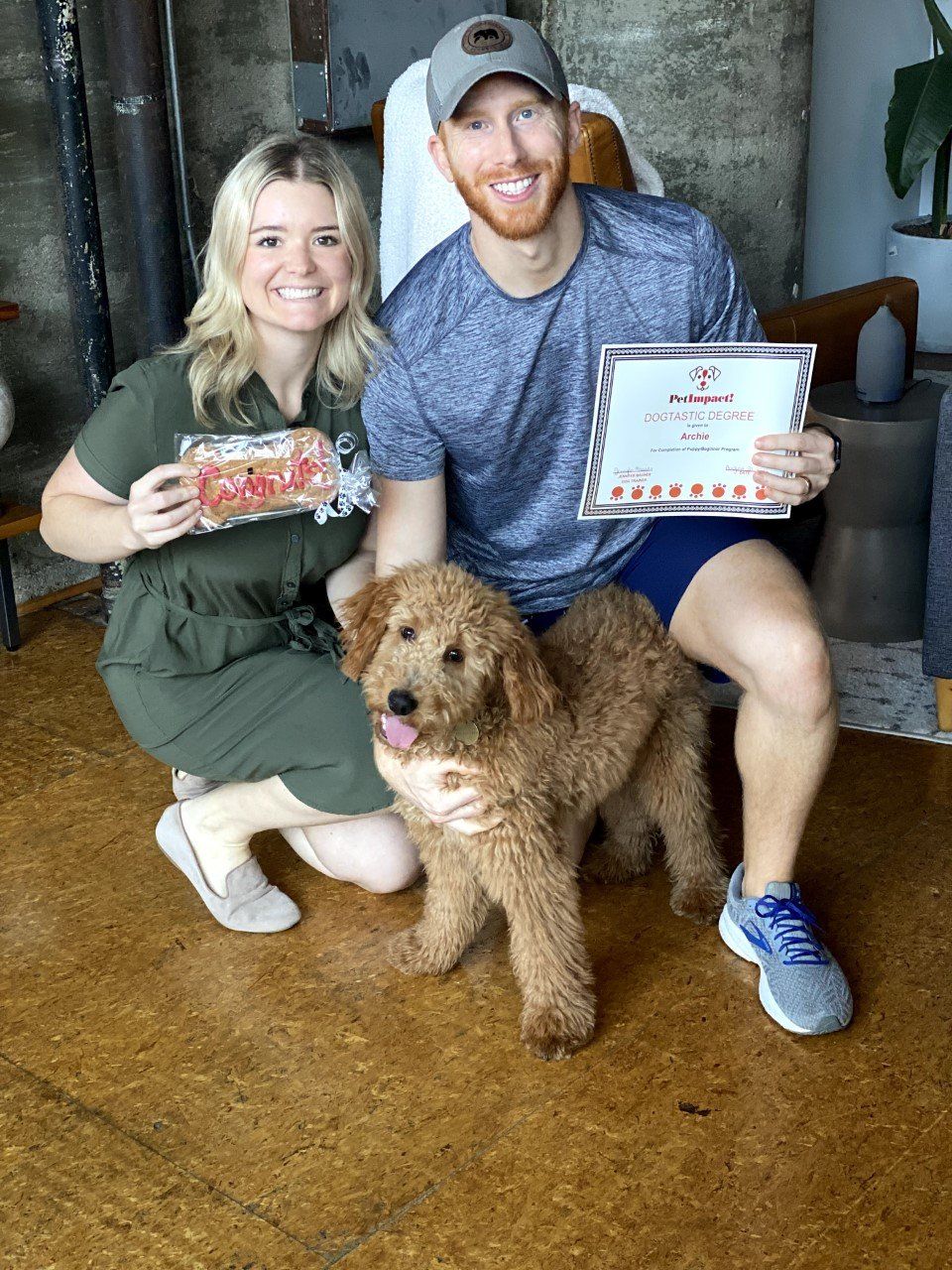 Dog Archie With Its Owner Couple Holding Certificate — St. Louis, MO — PetImpact!