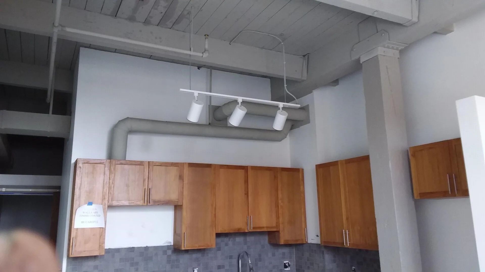 duct working going through a kitchen