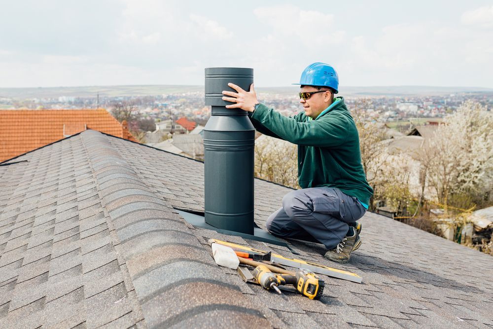 man repairing chimney on roof