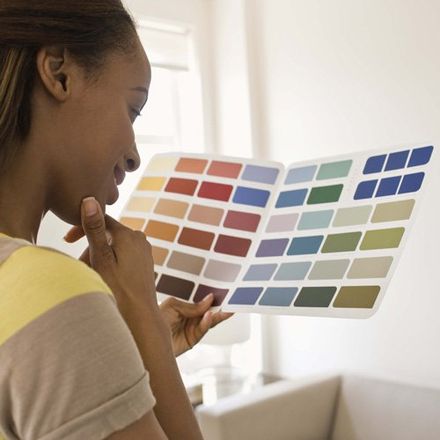 woman looking at colour catalogue