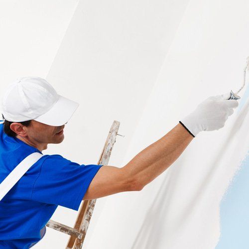 professional painter painting walls