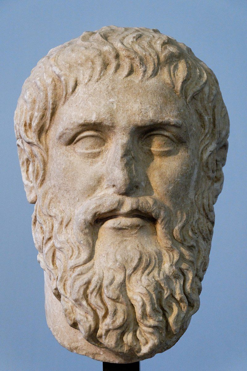 A statue of a man with a beard and curly hair