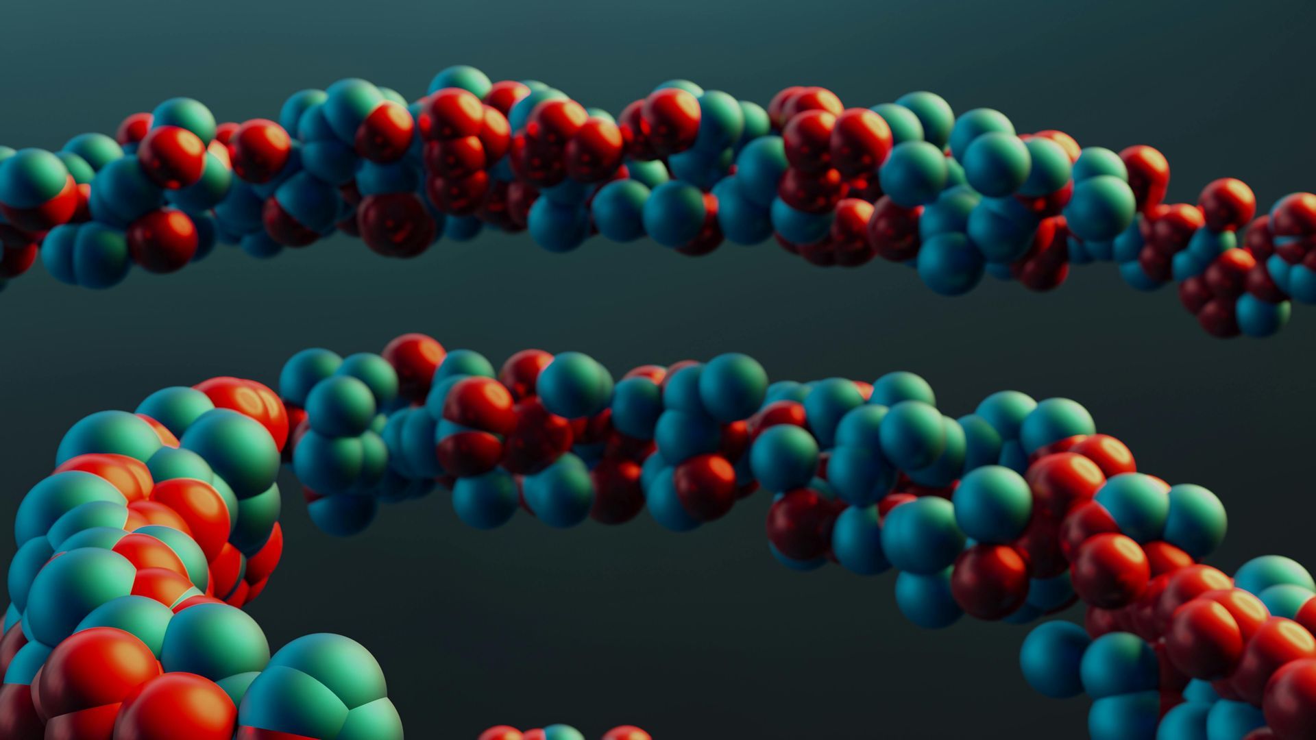 3D rendering of intertwined strings of blue and red spheres against a dark teal background, resembling a strand of DNA.