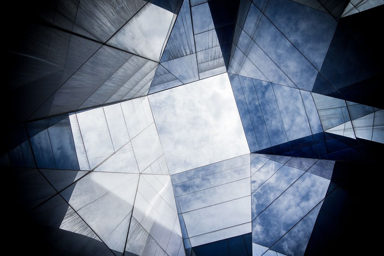 Looking up at a building with a blue sky in the background