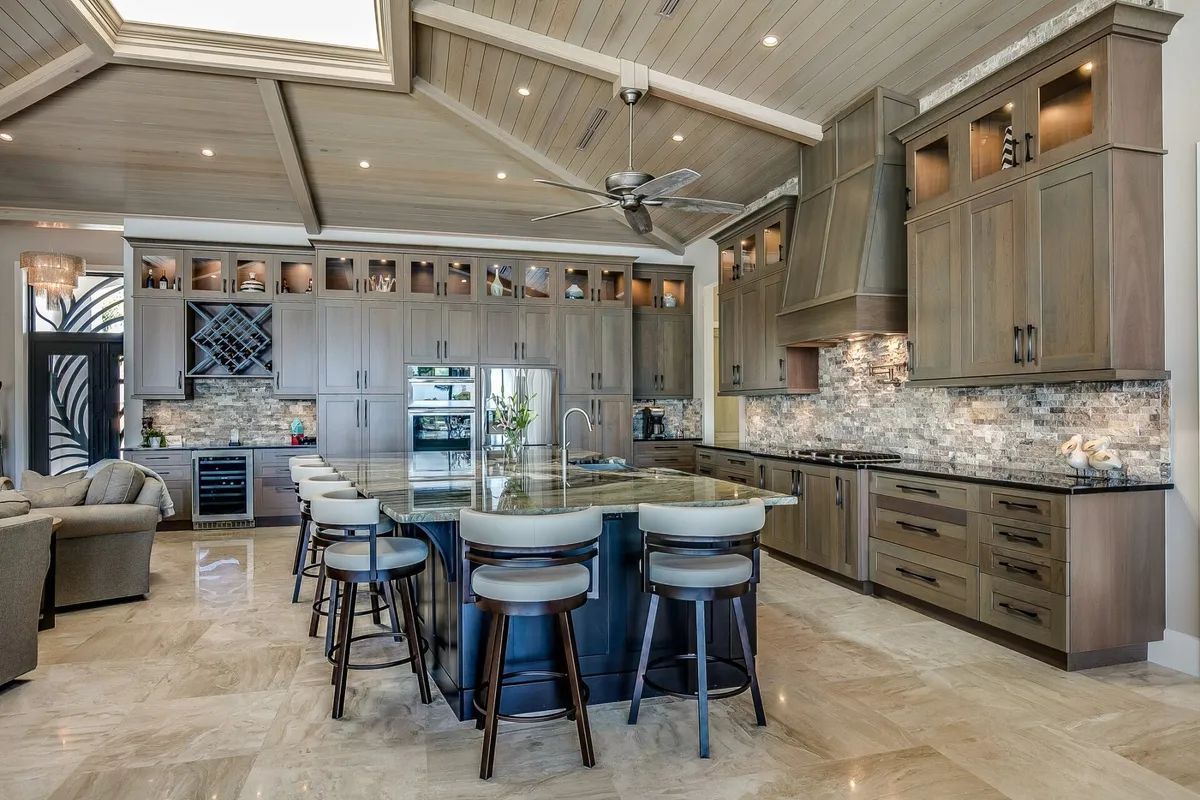 There is a large island in the middle of the kitchen.