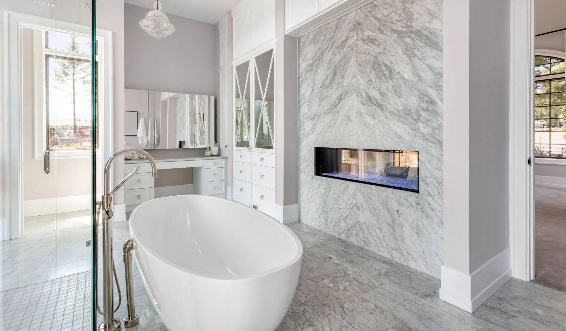 A living room with a fireplace and a flat screen tv