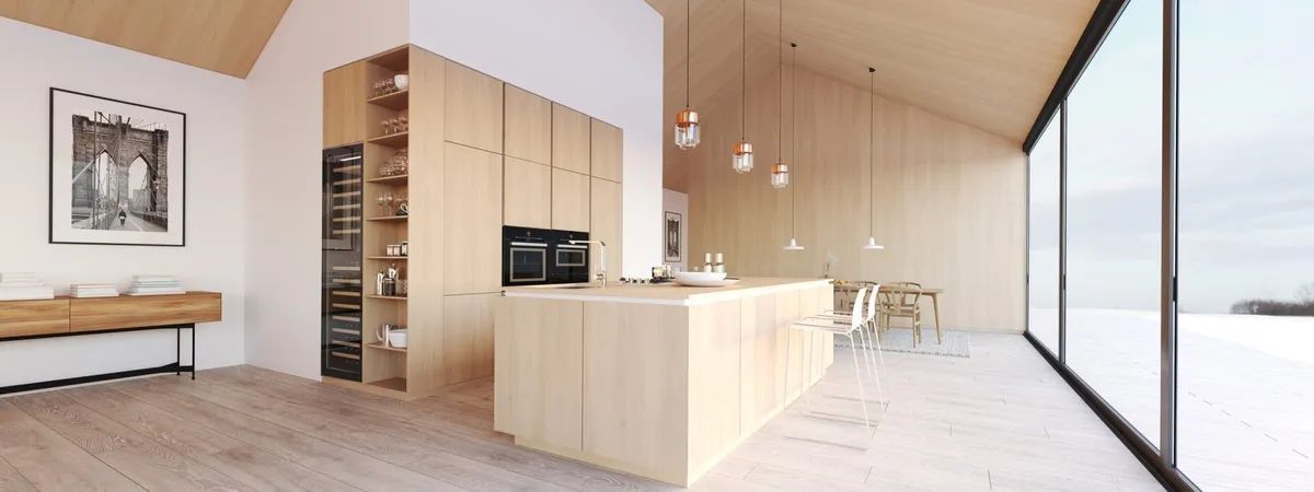 A kitchen with wooden cabinets and a large island in the middle of the room.