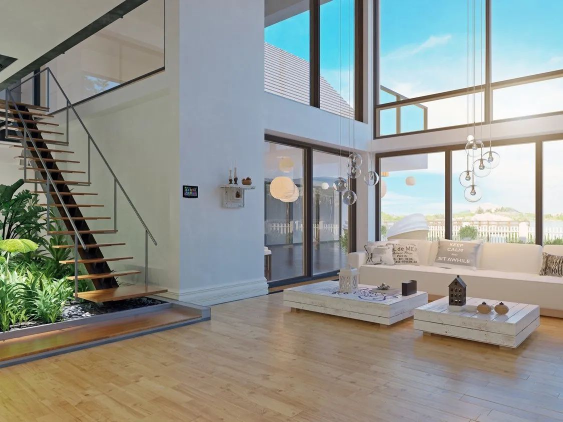 A man is sitting on a table in a room with lots of chandeliers