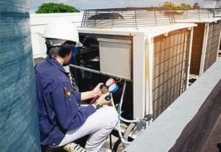 Technician Repairing Air Conditioning — Air Conditioning Contractors in Forest City NC