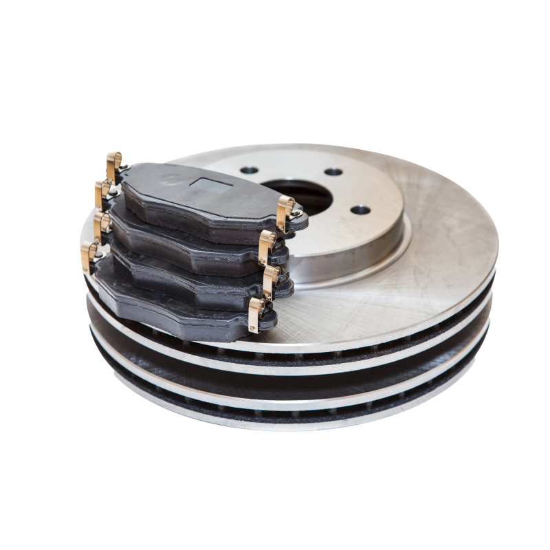 A stack of brake pads and rotors on a white background.