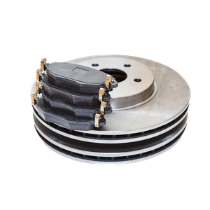 A stack of brake pads and rotors on a white background.
