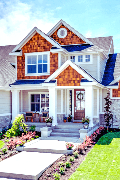 contemporary house with white windows and wooden front door with glass insert