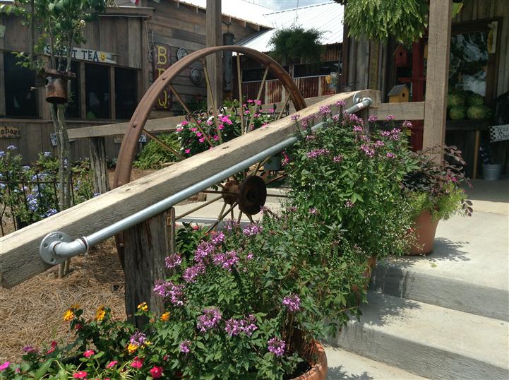 Stair railing with wheel decoration and plants