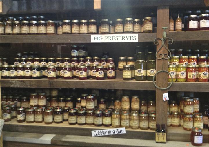 Jarred preserved figs along with jarred cobbler. As well as other jarred delicacies